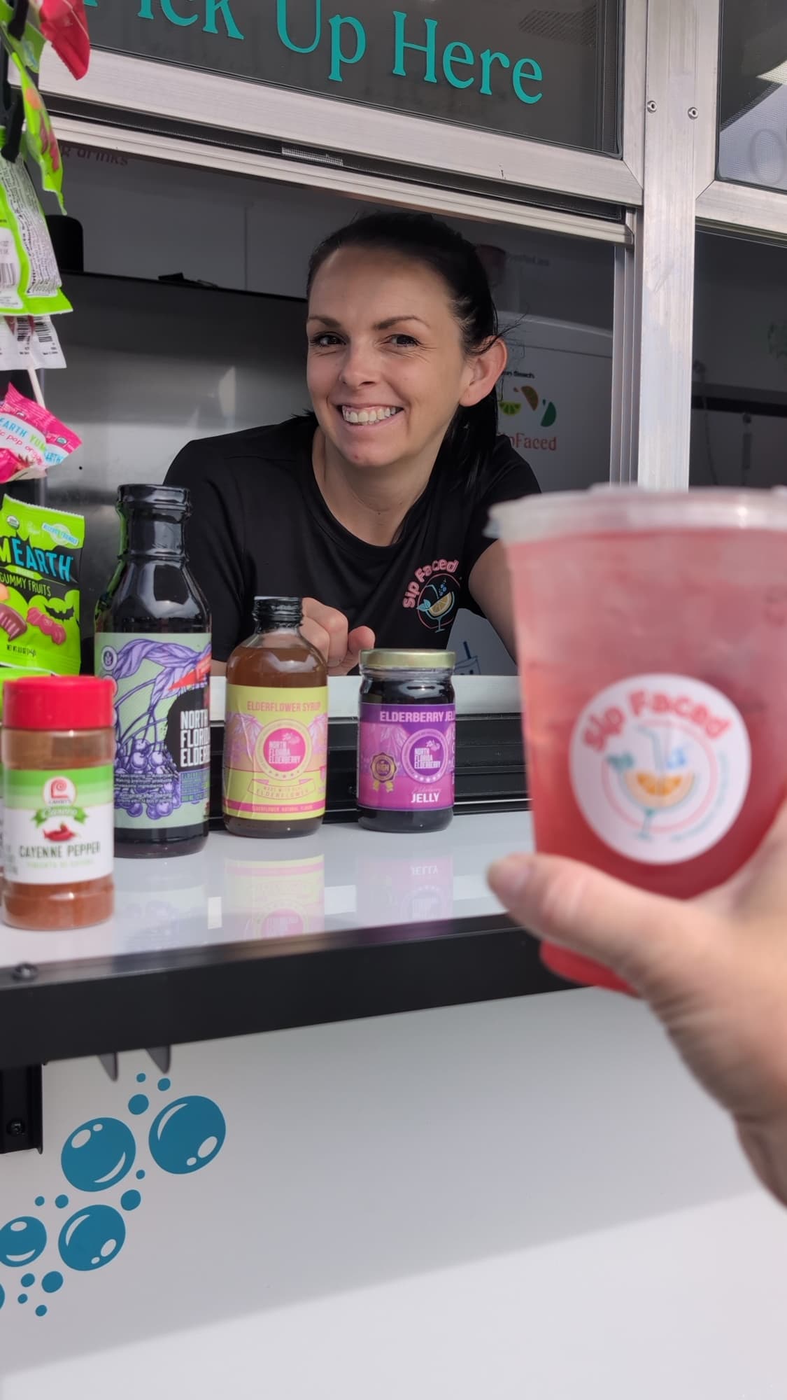Sip Faced owner making whole-fruit syrups at the counter